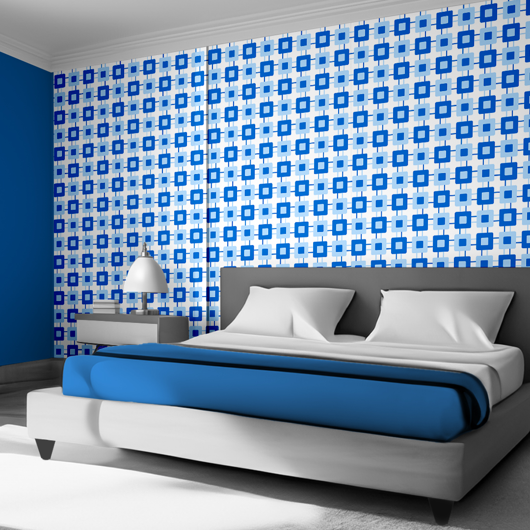 The artwork features a repeating geometric pattern of symmetrical shapes resembling elongated, curved diamonds or petals in various shades of blue and green. Each shape is split vertically with one half filled with a light blue and the other half filled with green or darker blue. The background is a light, almost pastel blue, which provides a soft yet vibrant backdrop. One of the blue shapes near the upper left contains a white starburst element, adding a focal point of brightness to the composition. The overall design conveys a modern, mid-century aesthetic with clean lines and harmonious color contrasts.